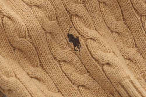 Close up of Brown cardigan with brand logo