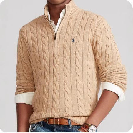 Camel cable knit sweater with a black logo on a white background