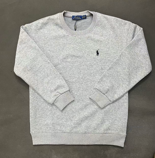 Gray sweatshirt with a small logo on a dark gray background