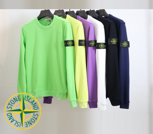 Five sweatshirts in green, yellow, purple, black, and blue hanging on a rack with Stone Island logo.