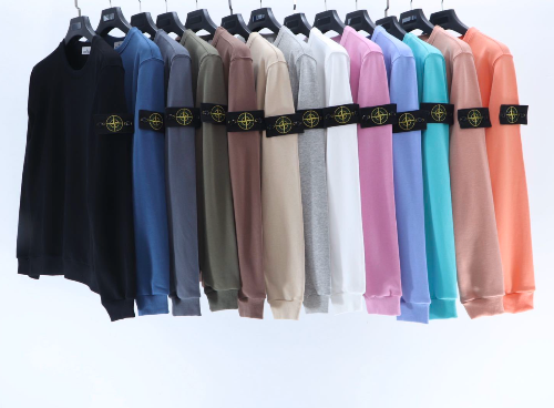 Row of sweatshirts in various colors with a brand logo on a white background