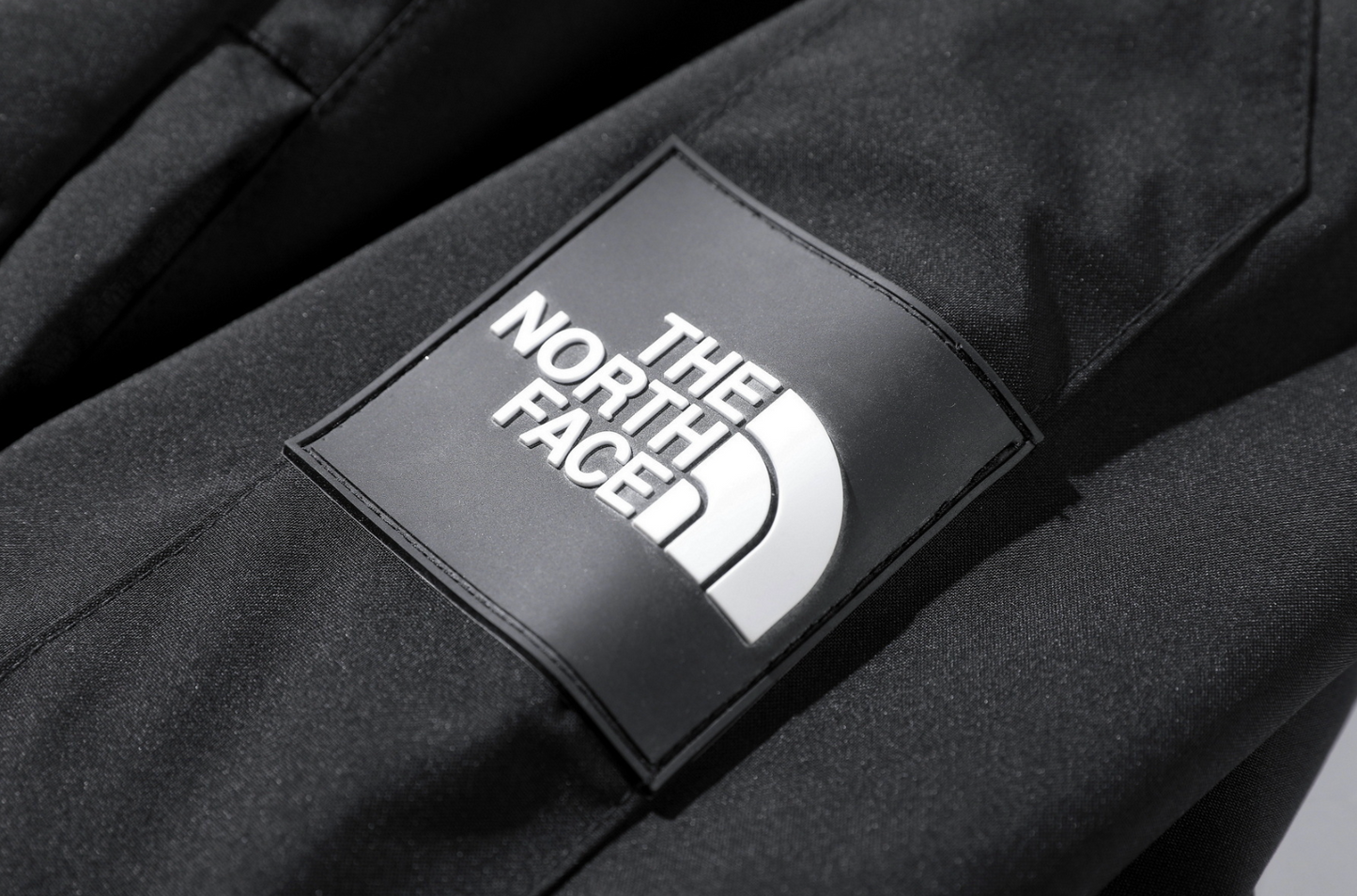 The North Face logo on a black jacket