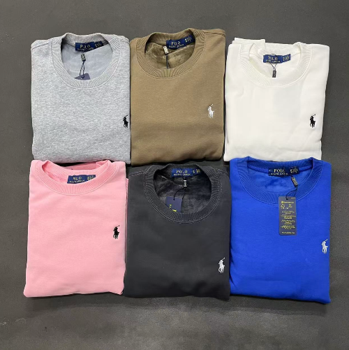 Folded shirts in gray, green, white, pink, black, and blue with Polo Ralph Lauren logo on a gray background.