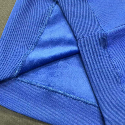 Close-up of a blue fabric texture with a visible seam