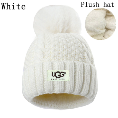 White plush hat with UGG logo on a white background