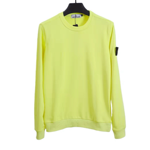 Yellow sweatshirt on a hanger against a white background