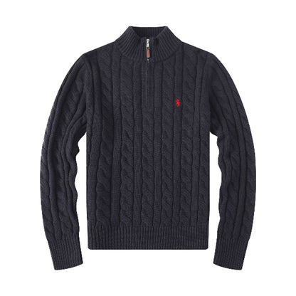 Navy cable knit sweater with a red logo on a white background