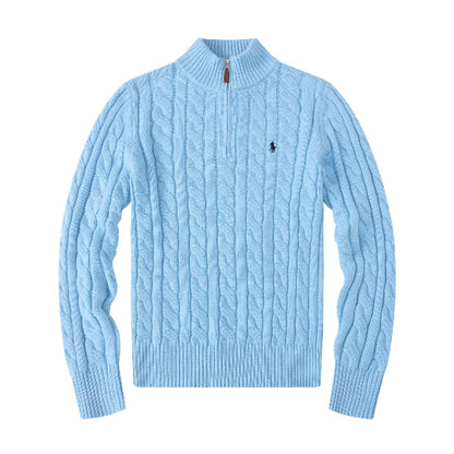 Light blue cable knit sweater with a quarter zip on a white background