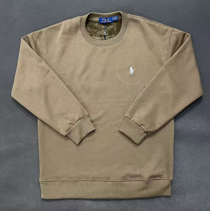 Beige sweatshirt with a logo on a gray background