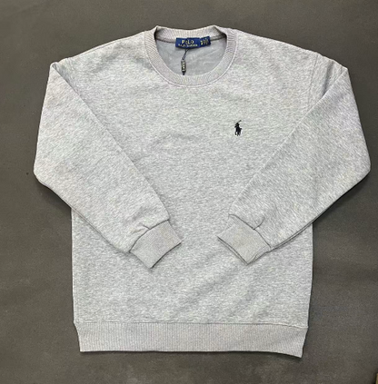 Gray sweatshirt with a small logo on a dark gray background