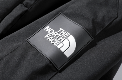 The North Face logo on a black jacket