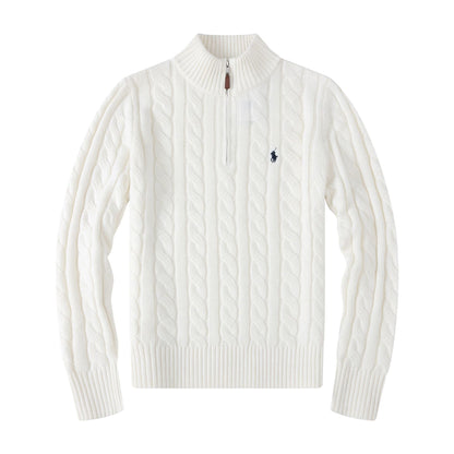 White cable knit sweater with a small logo on a white background