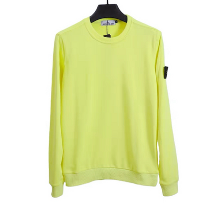 Yellow sweatshirt on a hanger against a white background
